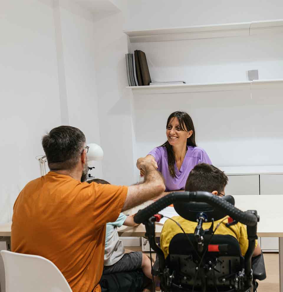 Special Needs Trust Attorney Denver Doctor greeting father and children in clinic office