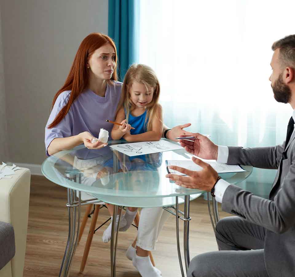 Trust Attorney Denver Mother and daughter meeting with advisor at table