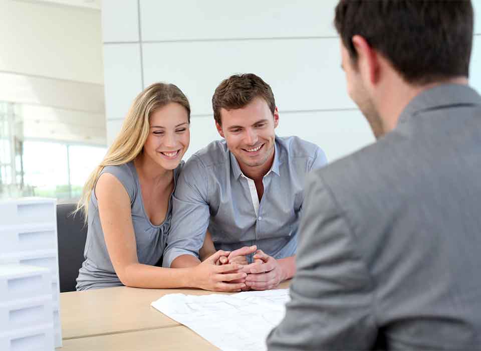 Why Denver Families Choose The EDS Estate Planning Couple meeting with advisor reviewing home plans